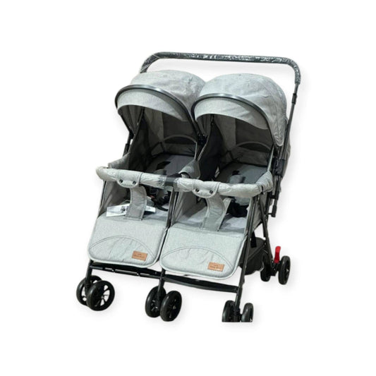 Double stroller with two seats on a white background
