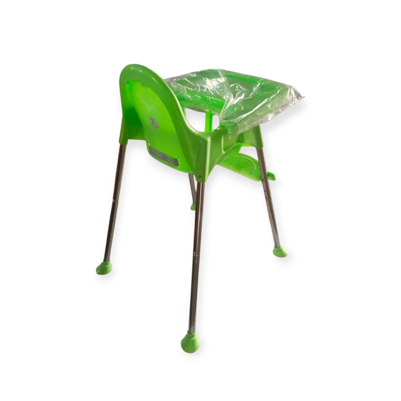 Green plastic high chair with a clear plastic cover on a white background