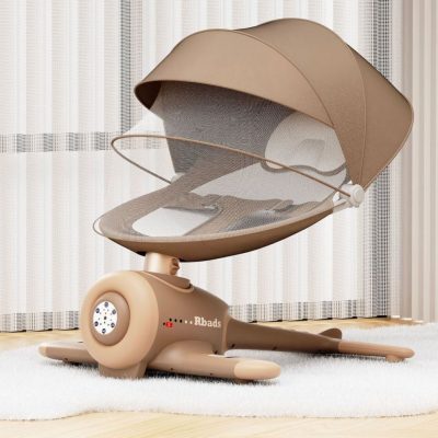 Baby swing chair with canopy on a white rug in a room with striped wallpaper